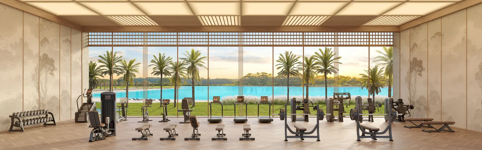 Fitness center do clube, com aparelhos alinhados diante de uma parede inteira de vidro voltada para a lagoa