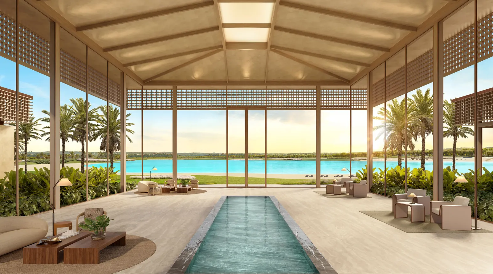 Lounge coberto do clube, com espelho d'água interno, poltronas e vista aberta para a lagoa